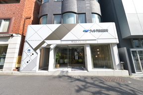 株式会社ウィル　恵比寿営業所の駒沢通り沿いに位置する店舗外観の写真
